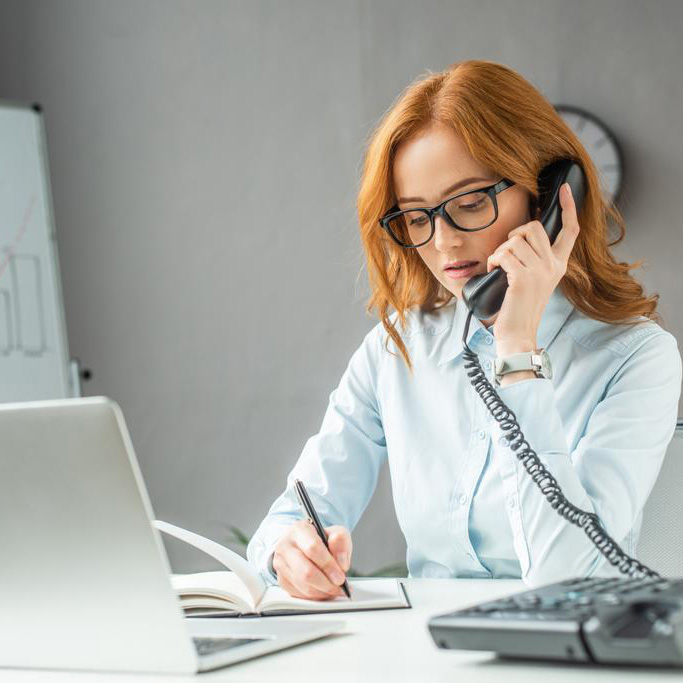 woman-talking-landline-telephone